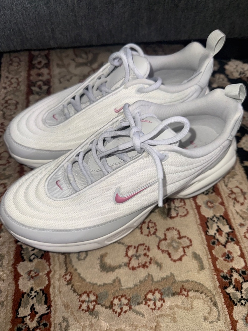 Nike White Sneakers with Pink Swoosh Accents